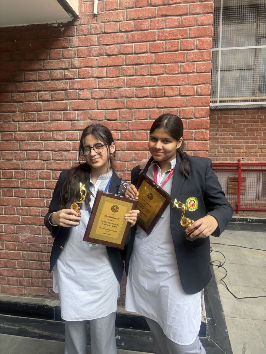 Holding trophies