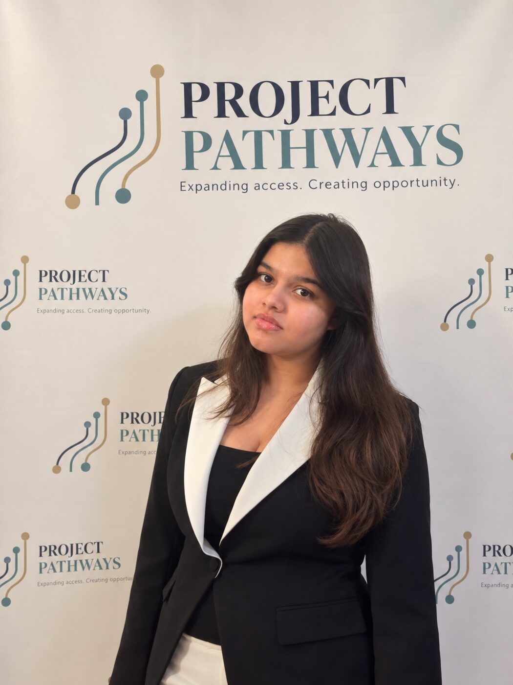 Yukti Dahiya in front of the Project Pathways backdrop