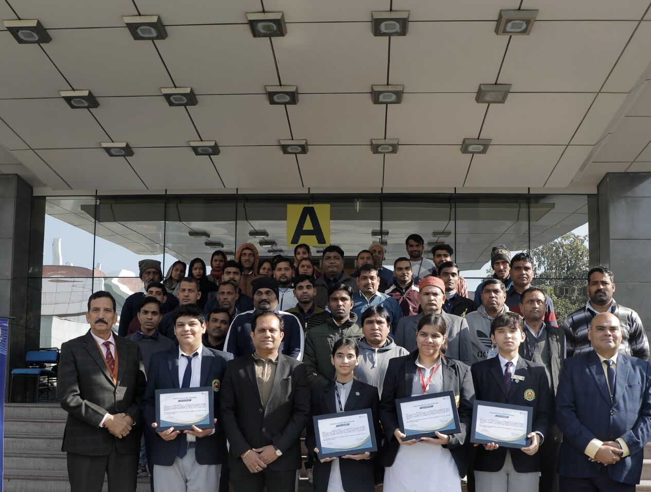 With the school's support staff after a session