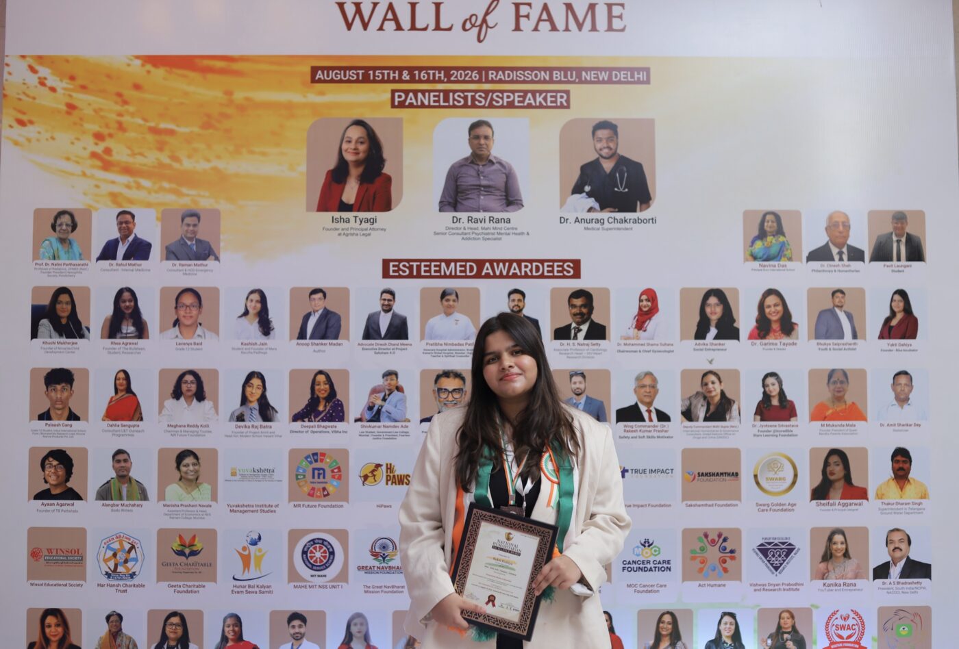 At the Wall of Fame with the National Humanitarian Excellence Award, New Delhi, August 2026